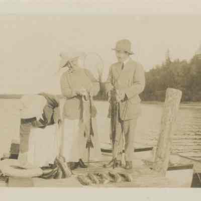 Five people on a dock