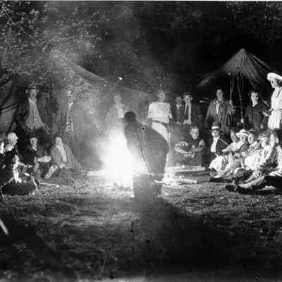 Group of people around a campfire
