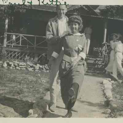 Couple standing in walk to Main Cabin at SunSands