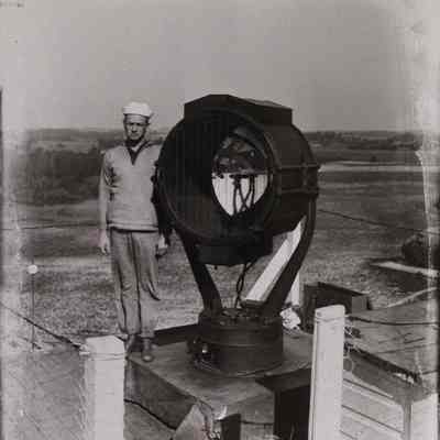 Navy sailor with signal light