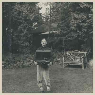 Carl Sheppard singing on the lawn
