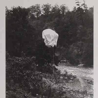 Parachute weighted with sandbags