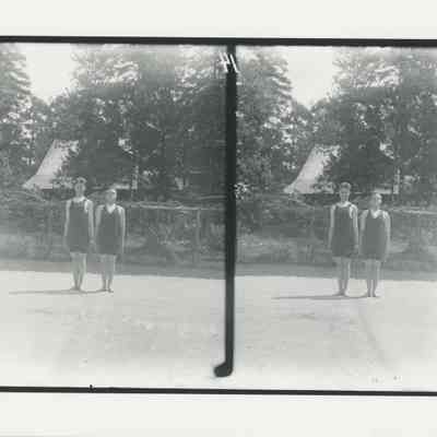 Two young men in swimsuits