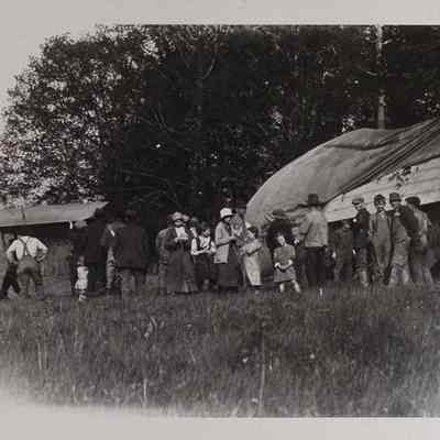 Large group around a crashed dirigible