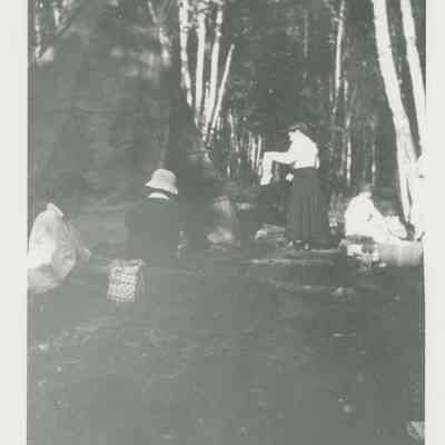 Group of people around a teepee at Hessel