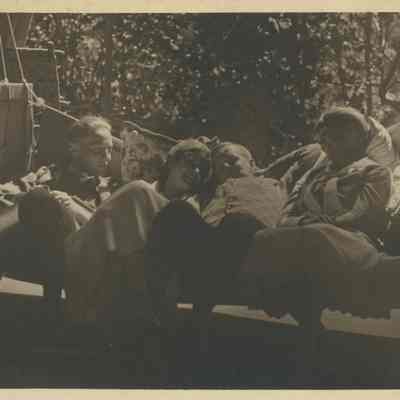 Four young people on a swing