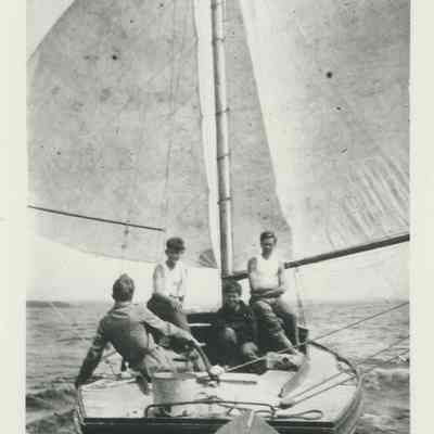 Four boys sailing on the "Wenonah"
