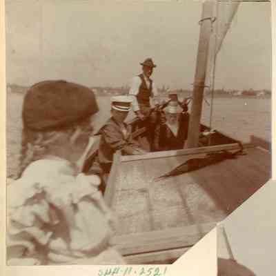 Four people on a sailboat