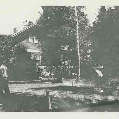 Young men playing croquet