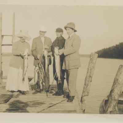 Four people on a dock
