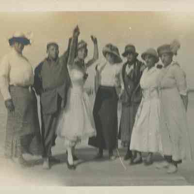 Seven young men in costume