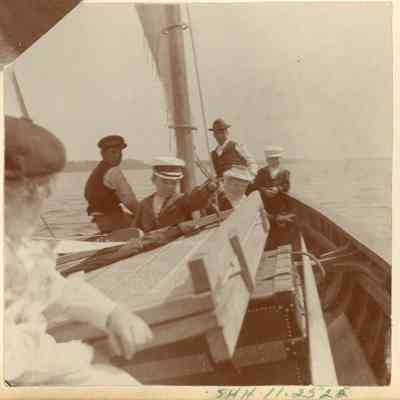 Six people on a sailboat