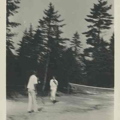 Two people playing tennis
