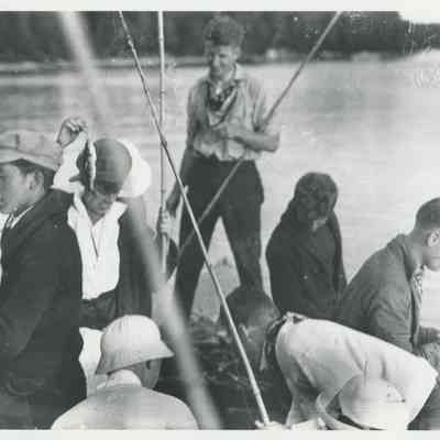 Group of people fishing from a boat