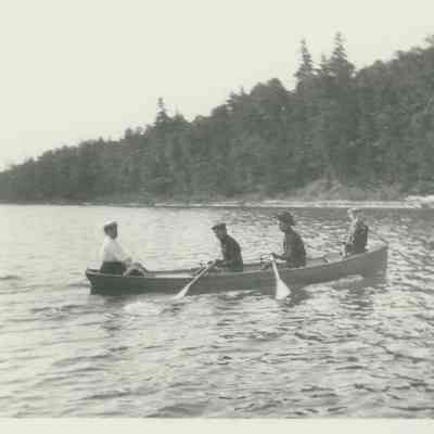 Four people in rowboat