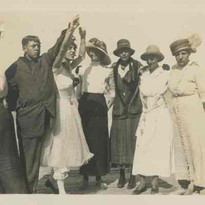 Seven young men in costume