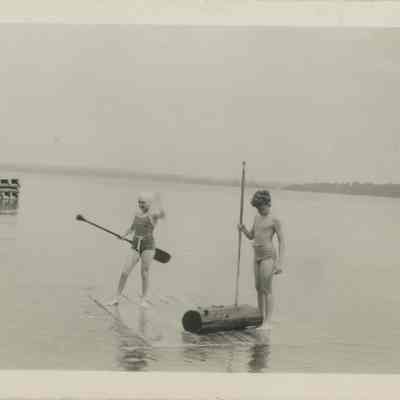 Two children playing in the lake