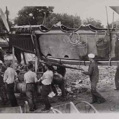 Men moving a gondola