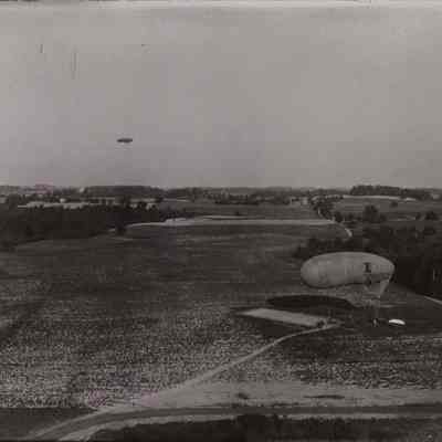 Two dirigibles, one in flight