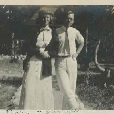 Couple standing in front of the Main Cabin at SunSands