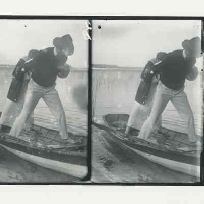 Man and woman standing on a skiff