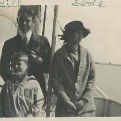 Three young people on a boat