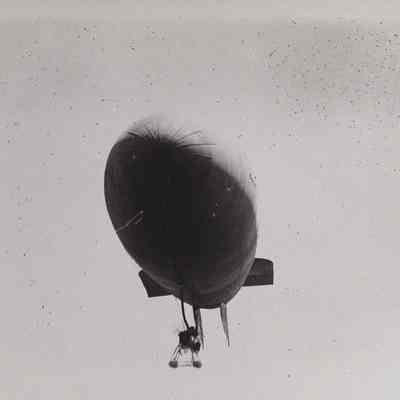 Close-up view of front of dirigible in the air
