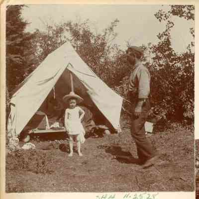 Man and children at camp site