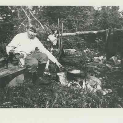 Young boy at a cookfire