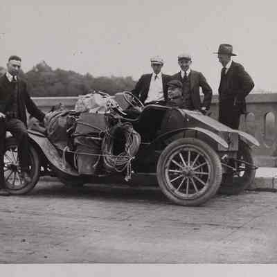 Five men preparing for parachute launch