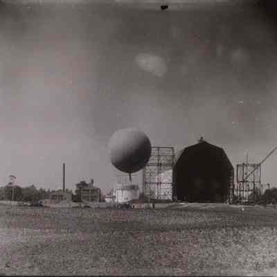 Balloon aloft outside hangar