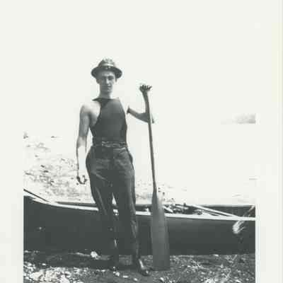 Young man with an oar