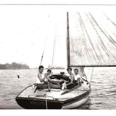 Four young men sailing on the "Wenonah"