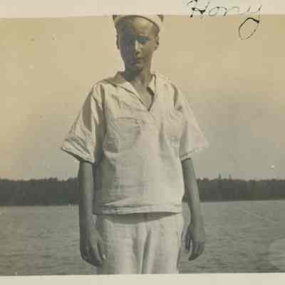 Young man in white sailor suit
