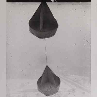 Two wind socks with view of land below