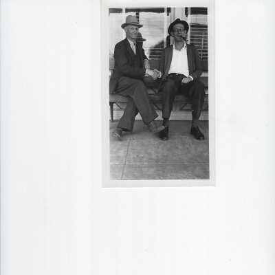 Two men setting front of the telephone office