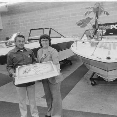 19790s couple with boats and cake