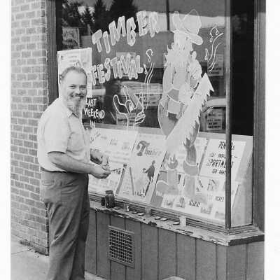 Estacada Store Window with Timber Festival Decoration