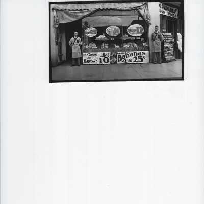 two Men standing in front of store