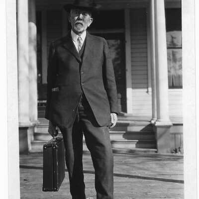 Ed Boner in front of Estacada Hotel