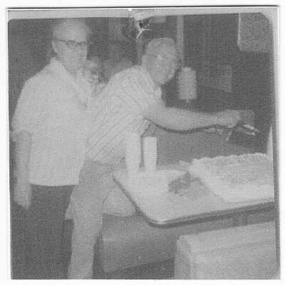 Two men with cake