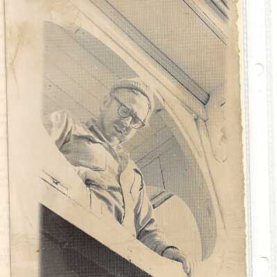 Photograph of Elwin Shibley working on steeple