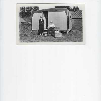 man and woman in front of trailer