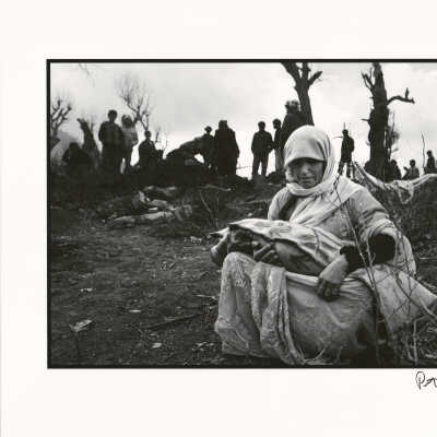 Kurdish woman buries her child in the mountains of Southern Turkey