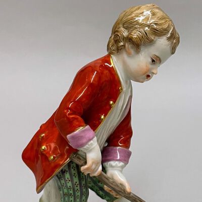Boy in a Red Coat with a Hoe