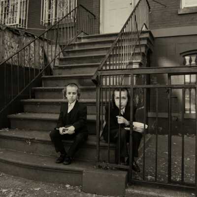 Two Boys Sitting on Stairs