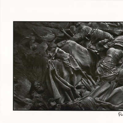 A mass grave. The bodies of Rwandan Hutu refugees who have died of cholera lie in a mass grave on the border between Rwanda and Zaire, near Goma, Zaire, shortly after the Rwandan genocide
