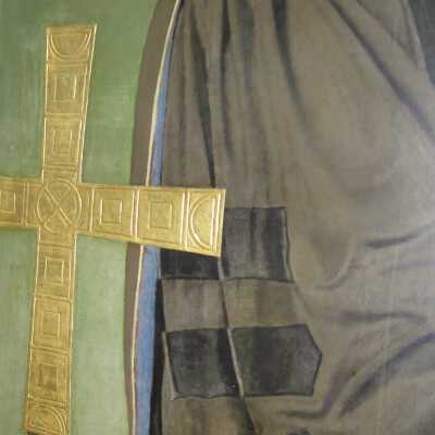 McClain gold embossed cross with small damage