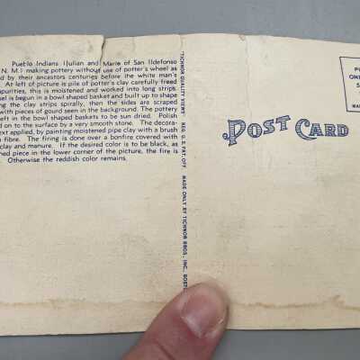 Postcard & envelope found in pot.: Picture of back of post card.