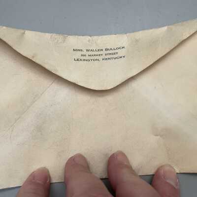 Postcard & envelope found in pot.: Picture of envelope with Mrs. Waller Bullock's return address on it.